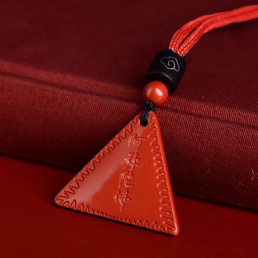 Orange-red cinnabar Amitabha Buddhist pendant with red braided rope lifestyle display variant