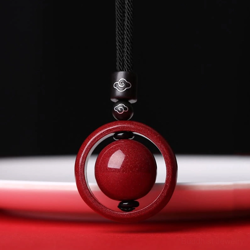 Cinnabar auspicious clouds pendant necklace with black rope showing feng shui wealth attraction