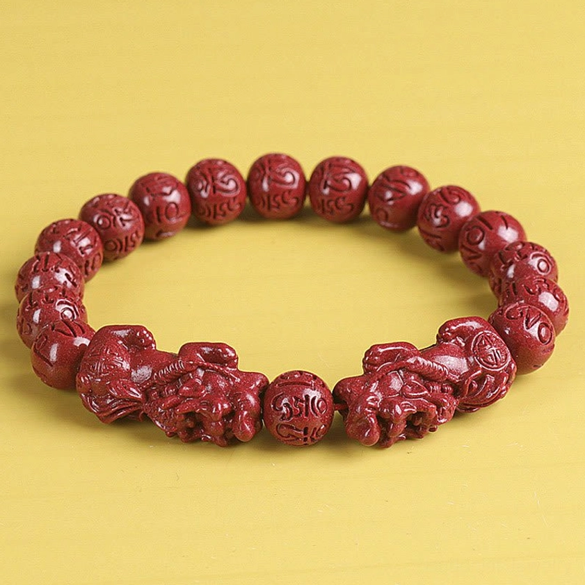 Red cinnabar bracelet with engraved character beads and double Pixiu charms