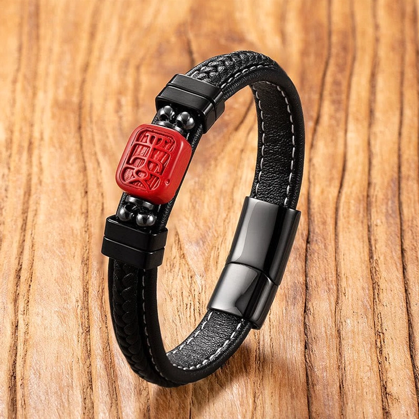 Multiple cinnabar Buddha and dragon leather bracelets showcasing different carved charm designs in black leather