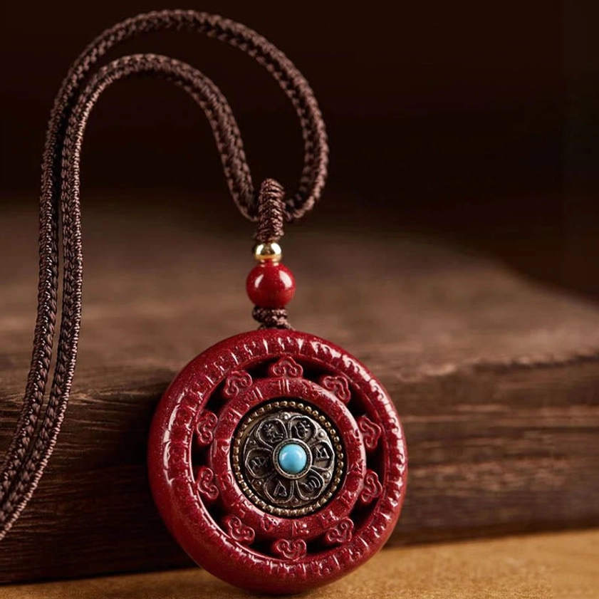 Cinnabar Om Mani Padme Hum Buddhist keychain with wooden buckle and rope attachment