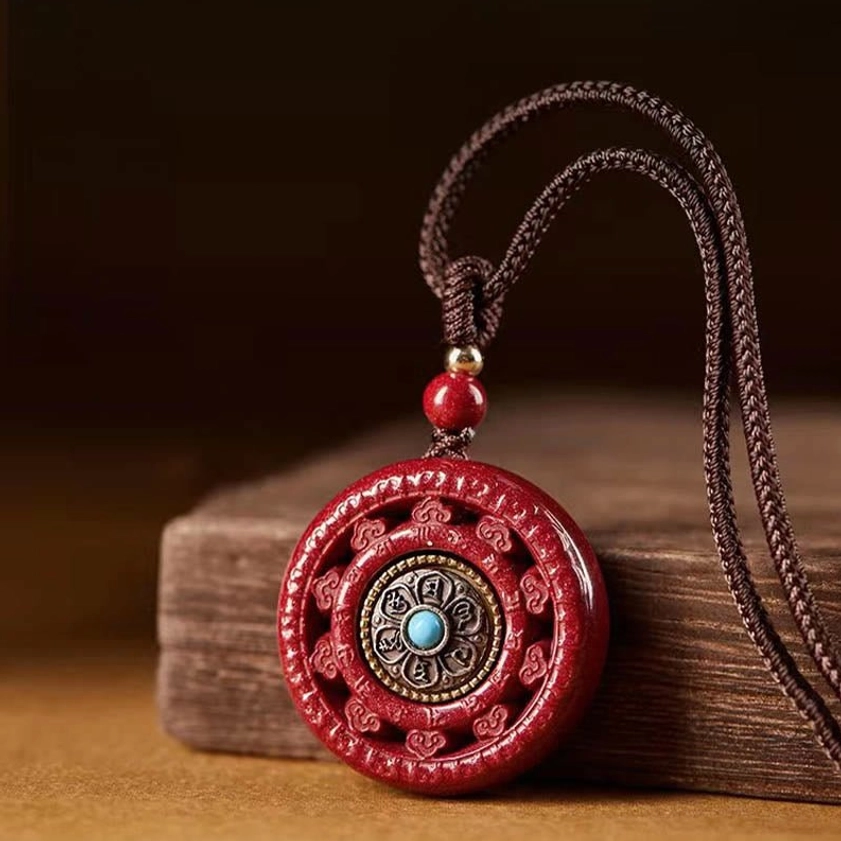 Cinnabar Om Mani Padme Hum necklace pendant with brown woven rope and red wooden bead