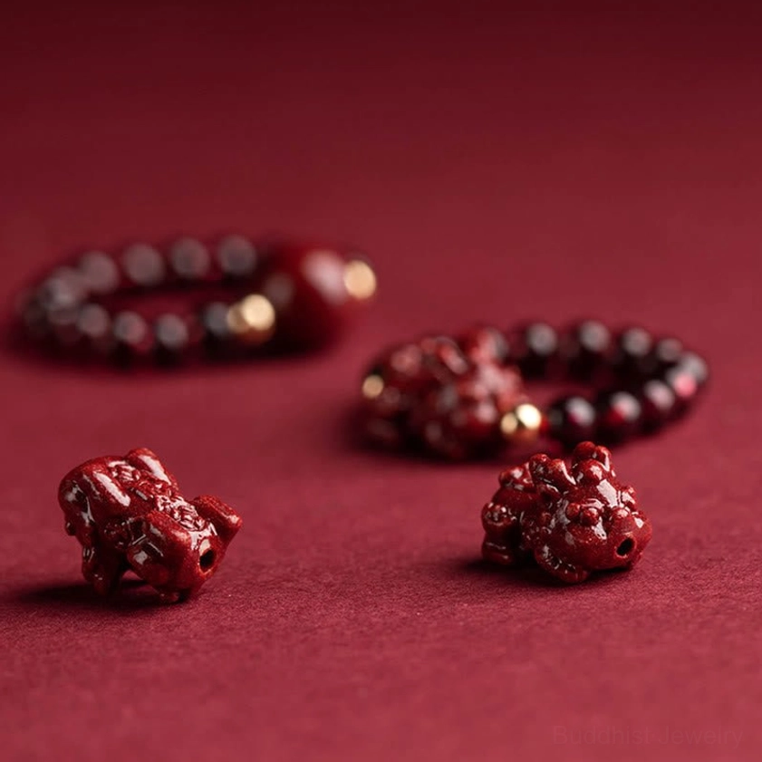Adjustable cinnabar beaded Buddhist ring collection showing multiple spiritual charm variations with garnet, large focal beads, and protective symbols