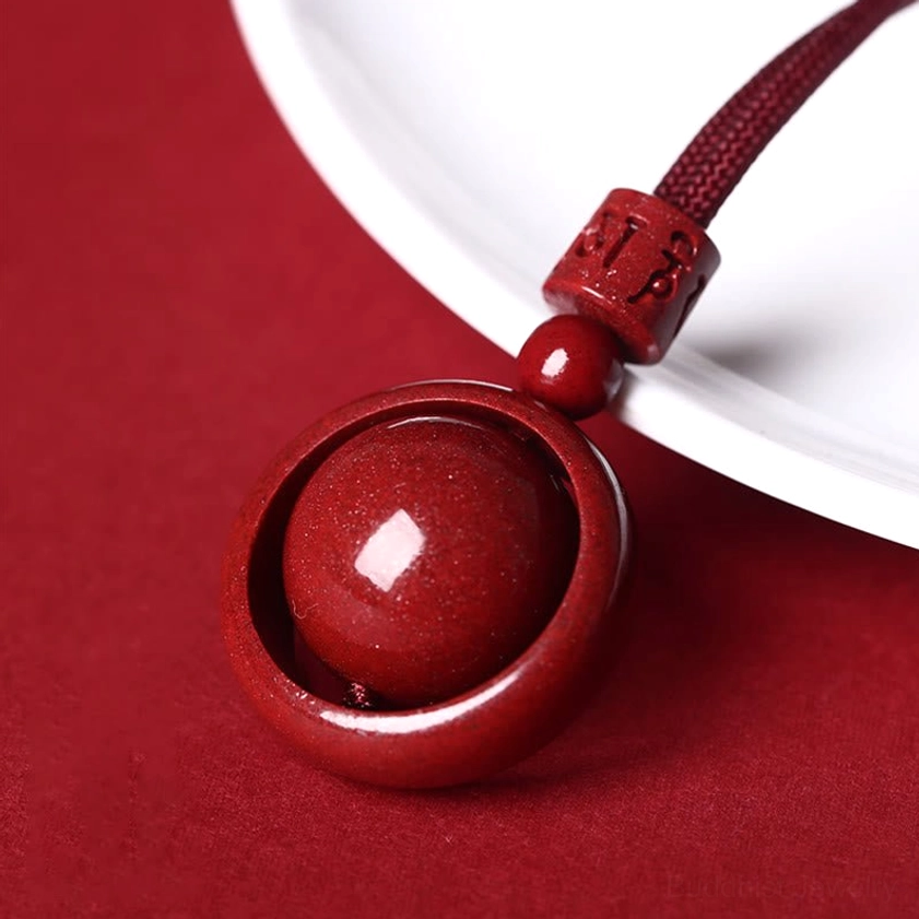 Buddhist cinnabar necklace pendant featuring sacred mantra carving and protective design