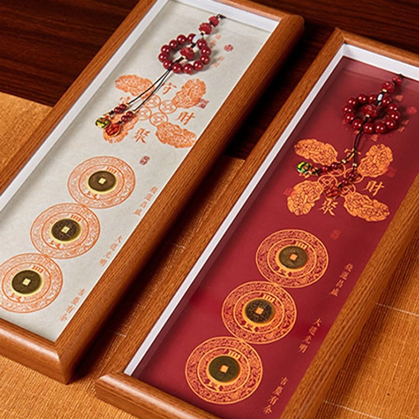 Side view of cinnabar fortune frame ornaments showing wooden frame structure and design details