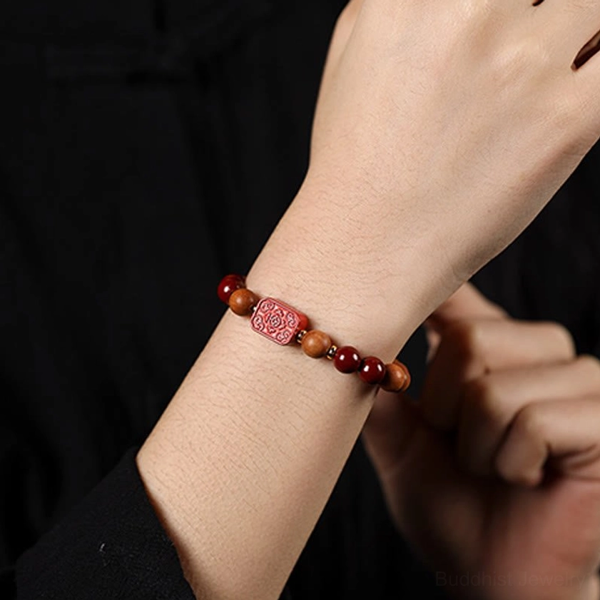 Handcrafted cinnabar and fu character blessing bracelet with red engraved fu charm and natural wood beads