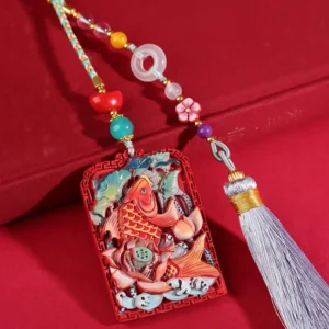 Cinnabar koi lotus car hanging decoration with peace buckle tassel, featuring hand-carved red pendant with colored koi and lotus patterns on red velvet background