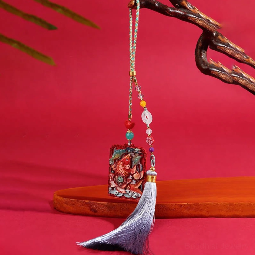 Cinnabar koi lotus car hanging ornament with peace buckle and grey tassel, displayed in decorative porcelain presentation box
