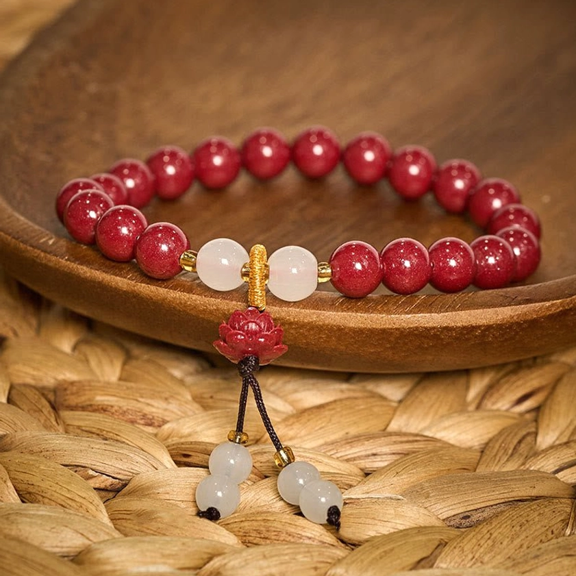 Handmade cinnabar lotus prayer bracelet detail view showing natural stone variations, bead quality, and artisan craftsmanship