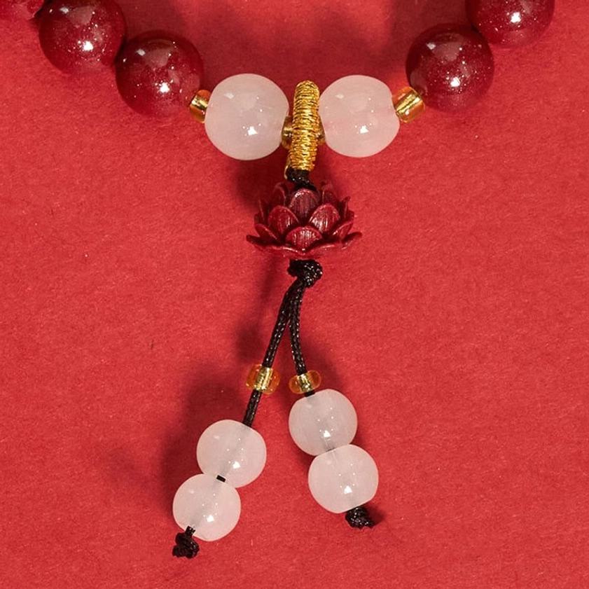 Natural cinnabar lotus bracelet packaged presentation showing complete handcrafted Buddhist prayer bead set with tassel pendant