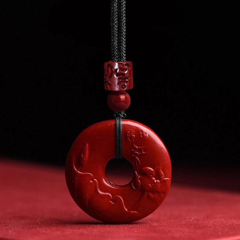 Cinnabar lotus peace buckle necklace with relief carved lotus flower pattern, handcrafted Buddhist pendant for spiritual protection and enlightenment