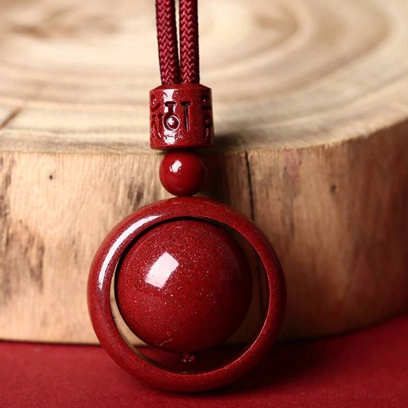 Speckled cinnabar round bead pendant necklace with carved mantra barrel bead and hollow outer ring