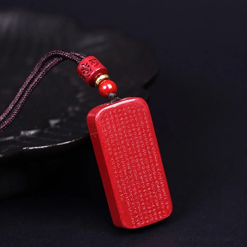 Cinnabar heart sutra necklace with black woven cord and decorative accent beads