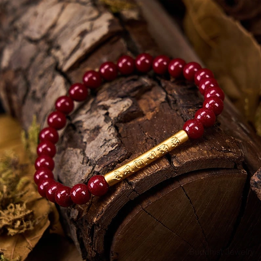 Buddhist wisdom bracelet with cinnabar beads and sterling silver on rustic wooden bark and dry leaves, vintage natural background