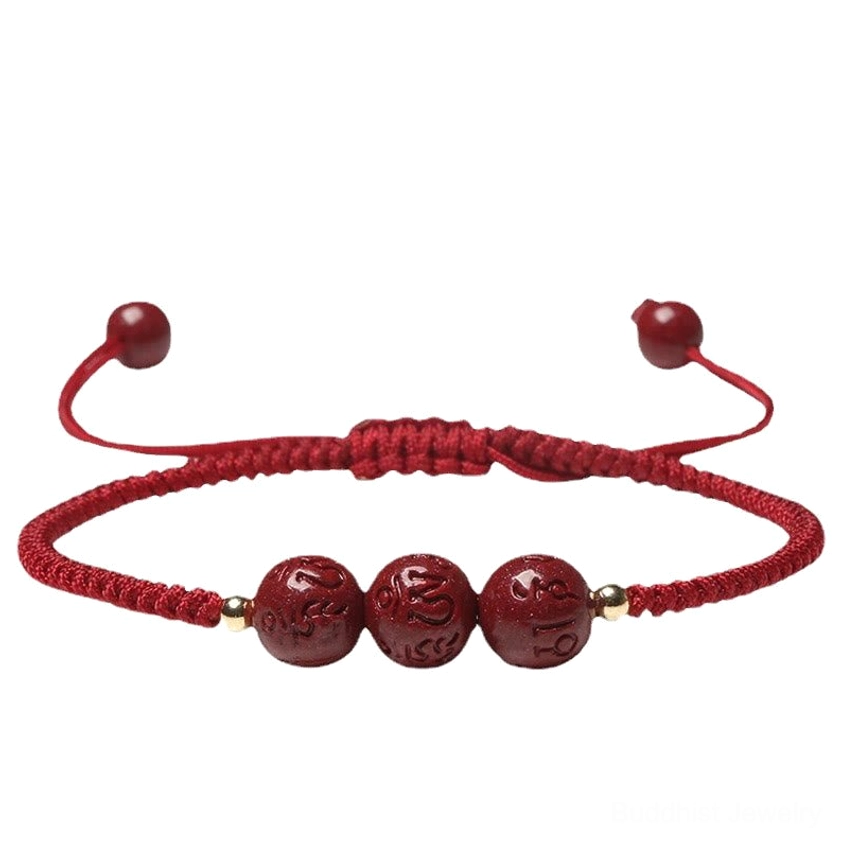 Handmade cinnabar Om Mani Padme Hum prayer bracelet flat lay showing pull-tight adjustable knot and carved mantra bead details