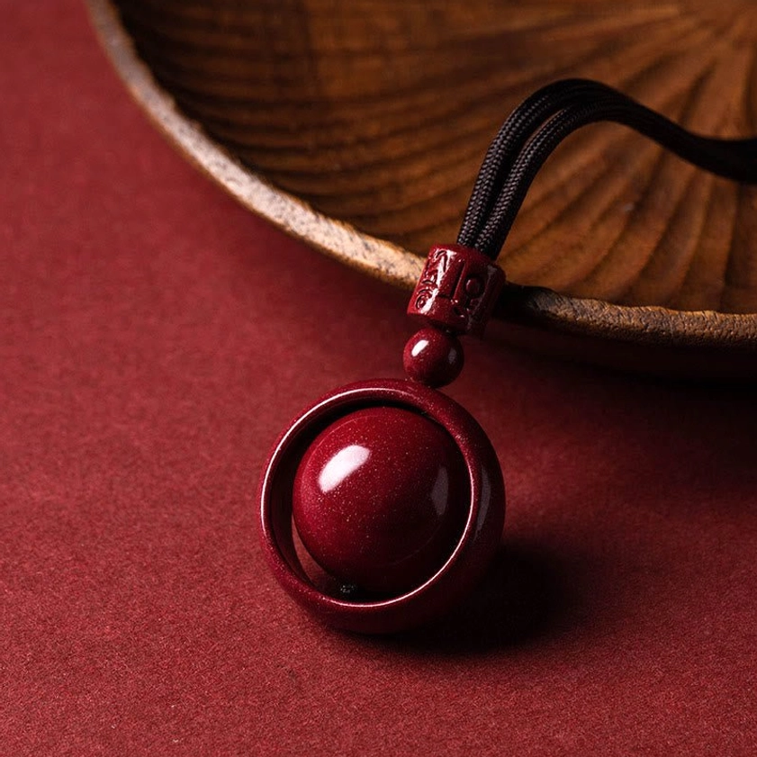 Cinnabar om mani padme hum pendant necklace with brown rope cord and traditional carving