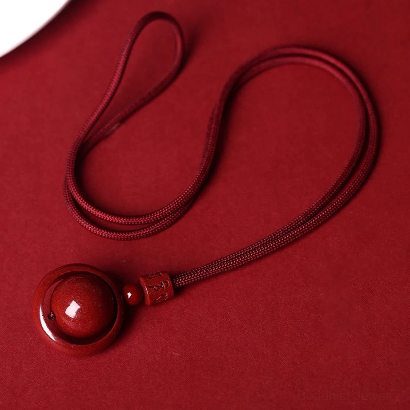 Handcrafted cinnabar om mani padme hum necklace pendant with protective spiritual energy