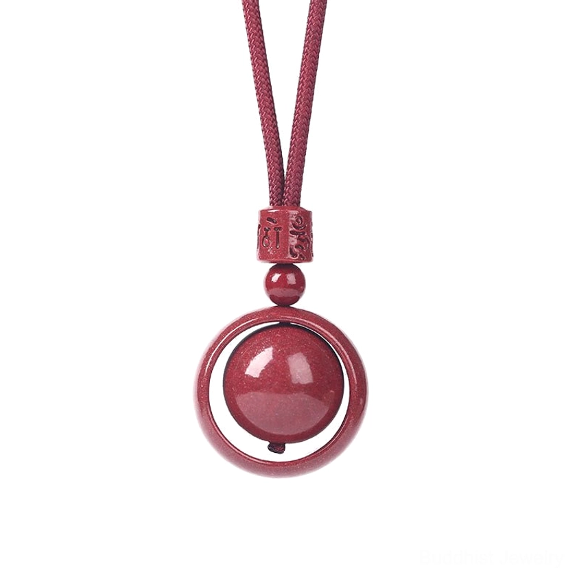 Cinnabar om mani padme hum pendant showing spiritual symbolism and handmade craftsmanship details