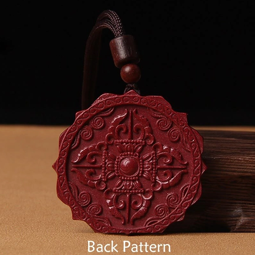 Reverse side of cinnabar lotus pendant necklace showing intricate vajra carved pattern buddhist symbol