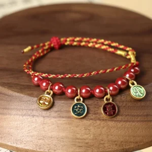 Cinnabar red string blessing bracelet with enamel pendants, artisanal handwoven design for peace and joy
