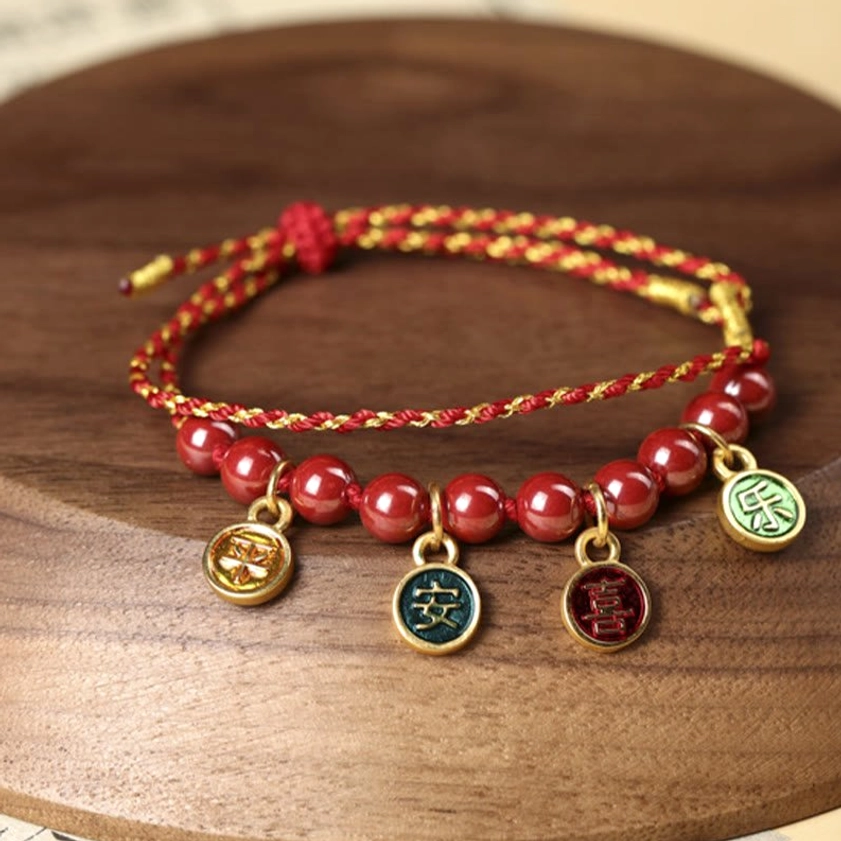 Cinnabar red string blessing bracelet with enamel pendants, artisanal handwoven design for peace and joy