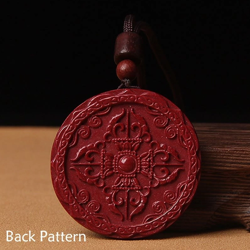 Reverse side round cinnabar blessing pendant showing detailed vajra pestle relief design buddhist