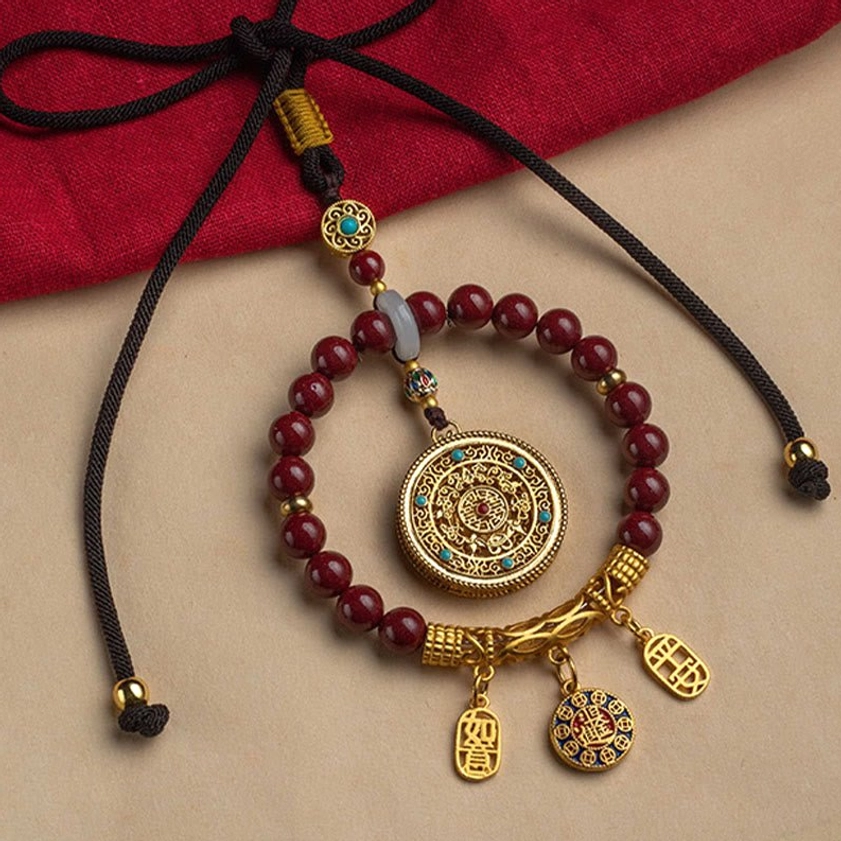 Complete handcrafted cinnabar ruyi car hanging ornament with braided cord, gold filigree pendant, and maroon stone beads, Buddhist peace charm