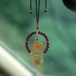 Natural cinnabar ruyi car hanging ornament with maroon beads and gold filigree pendant, traditional Buddhist blessing charm for protection and peace