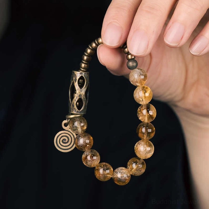 Handmade citrine beaded bracelet styled with natural stone beads and vintage metal charm accents