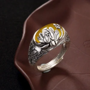 Citrine lotus buddhist ring front view with yellow gemstone and embossed lotus flower carving on vintage copper adjustable band