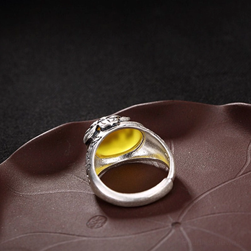 Bottom inner band view of adjustable citrine ring showing copper construction and back of yellow gemstone setting