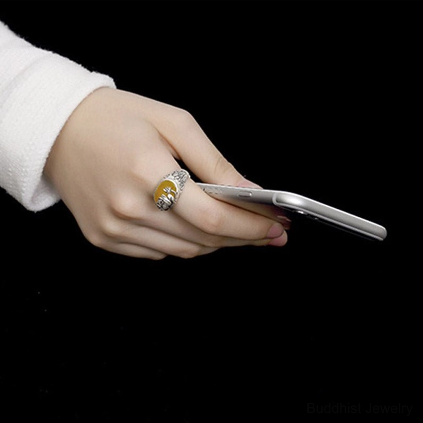 Side profile of adjustable citrine ring on finger demonstrating comfortable wear and detailed lotus carving visibility