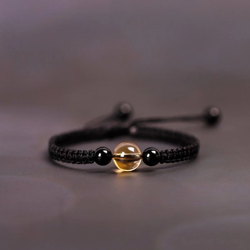 Handcrafted citrine black obsidian Buddhist blessing bracelet with adjustable knot cord