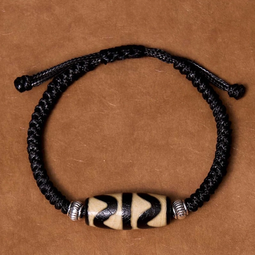 Classic dzi bead bracelet worn on wrist demonstrating adjustable fit and comfortable daily wear