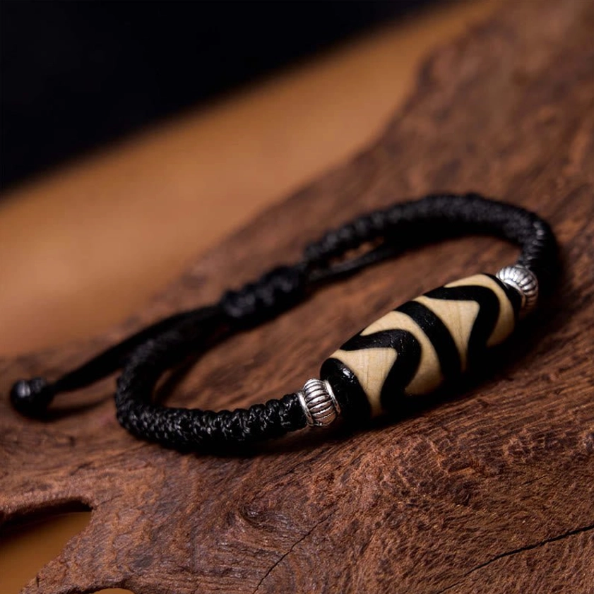 Classic dzi bead bracelet overhead perspective showing complete circular design on natural background