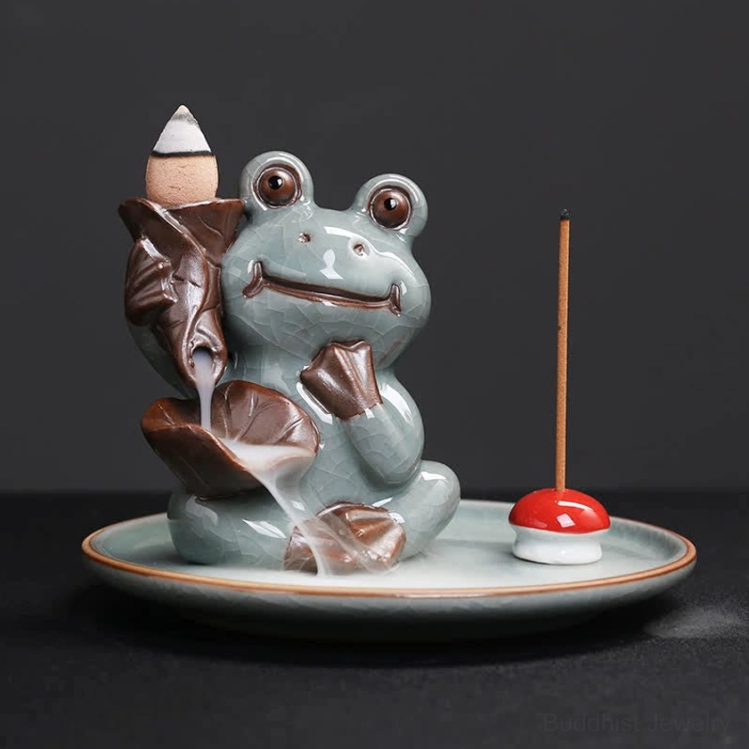 Classic frog incense burner in celadon ceramic with unique hand gesture holding lotus decoration, includes red mushroom incense stand