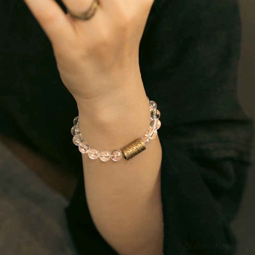 Multi-crystal quartz bracelet close-up front view worn on wrist showing clear beads