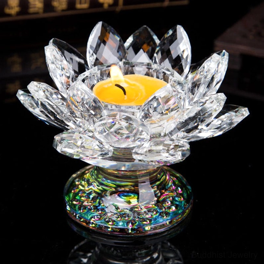 Clear quartz crystal lotus candleholder with lit tea light - three-quarter side view showing faceted petals