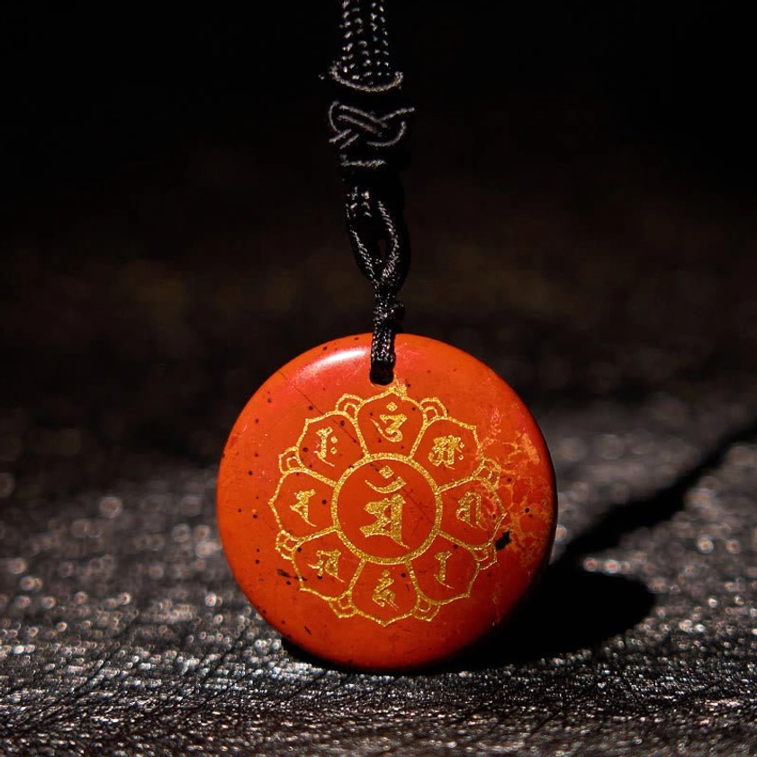 Clear Quartz Om Mani Padme Hum Buddhist pendant with gold Sanskrit design and natural stone characteristics
