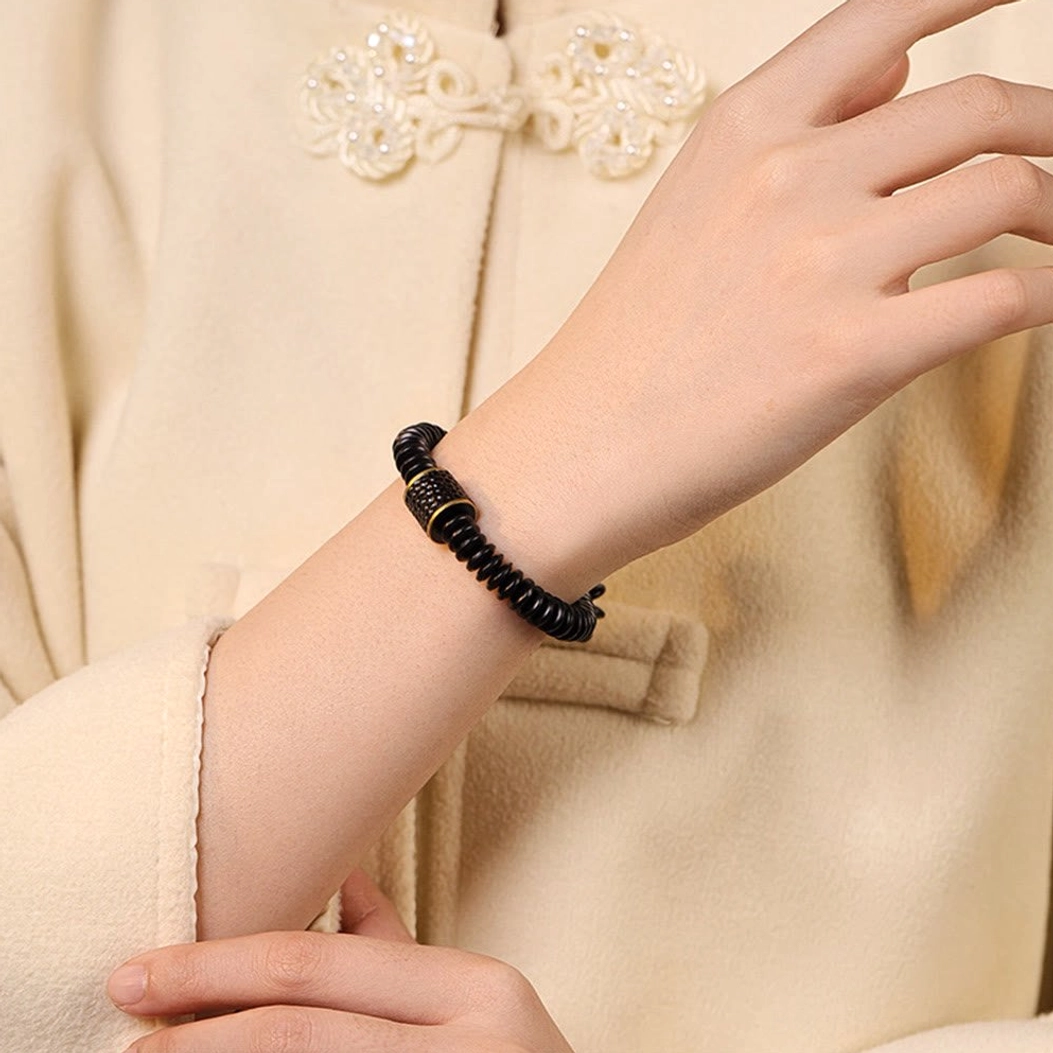 Handcrafted Buddhist coconut shell auspicious clouds bracelet featuring premium elastic string