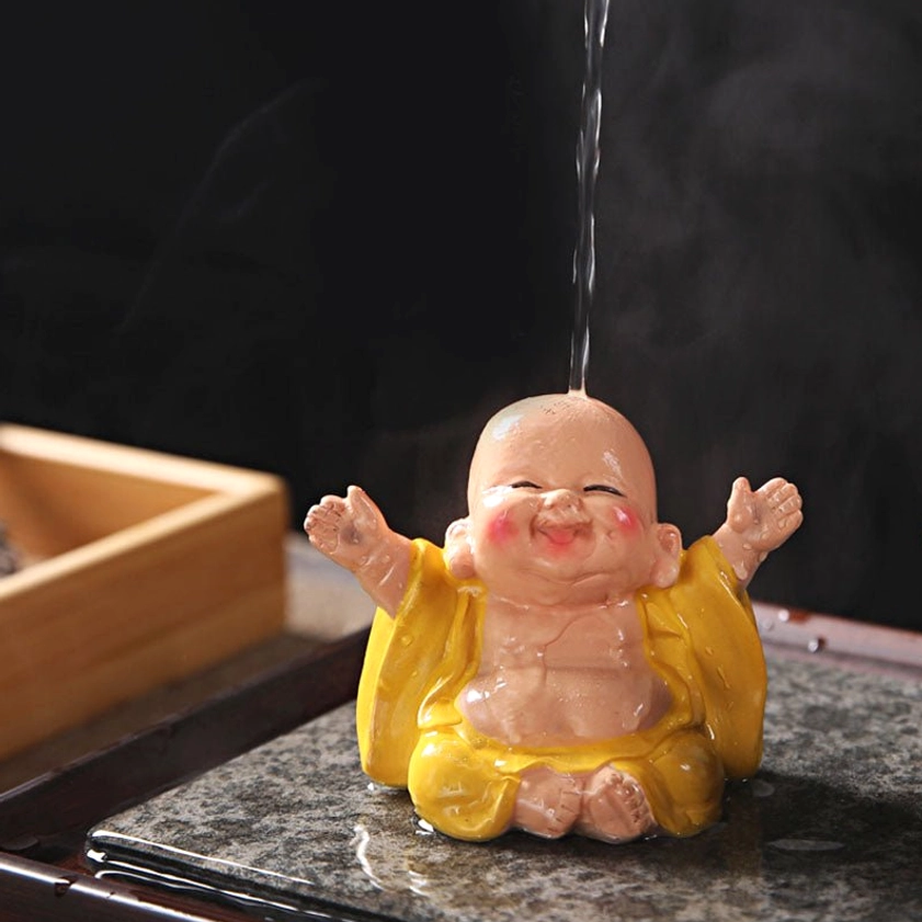Laughing Buddha resin tea pet collection showcase featuring multiple color variations for home décor and tea ceremony