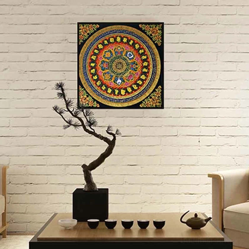 Colorful mandala thangka hanging on white brick living room wall - vibrant Buddhist Om Mani Padme Hum spiritual wall hanging