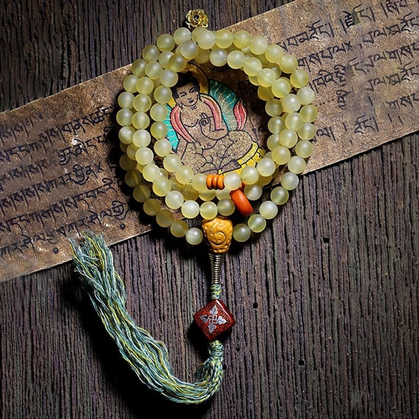 Complete view of 108 mala prayer beads showing full sacred bead count and tassel