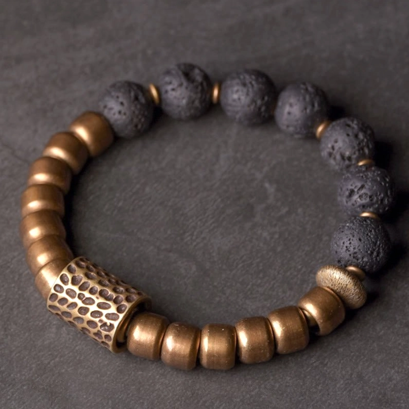 Complete lava rock obsidian brass healing bracelet, top-down view displaying full bead layout and arrangement