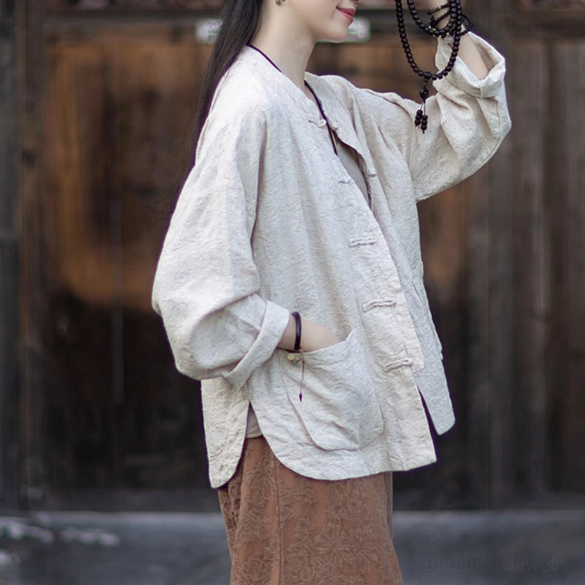 Front-facing shot of complete jacquard meditation shirt and pants ensemble with frog closures
