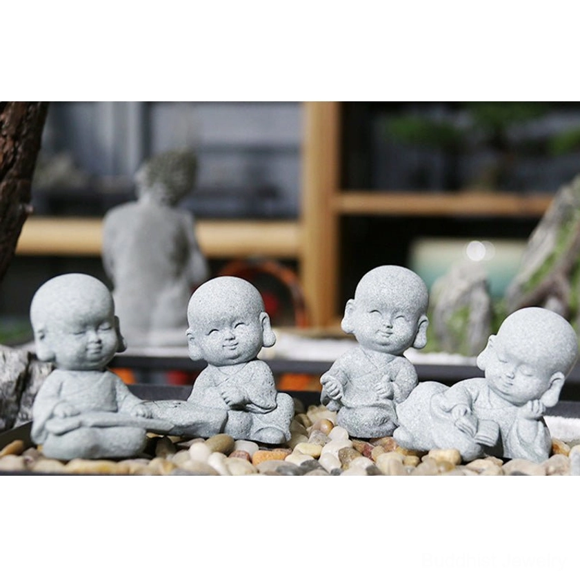 Collection of handcrafted monk Buddha statues showing all eight unique styles and poses