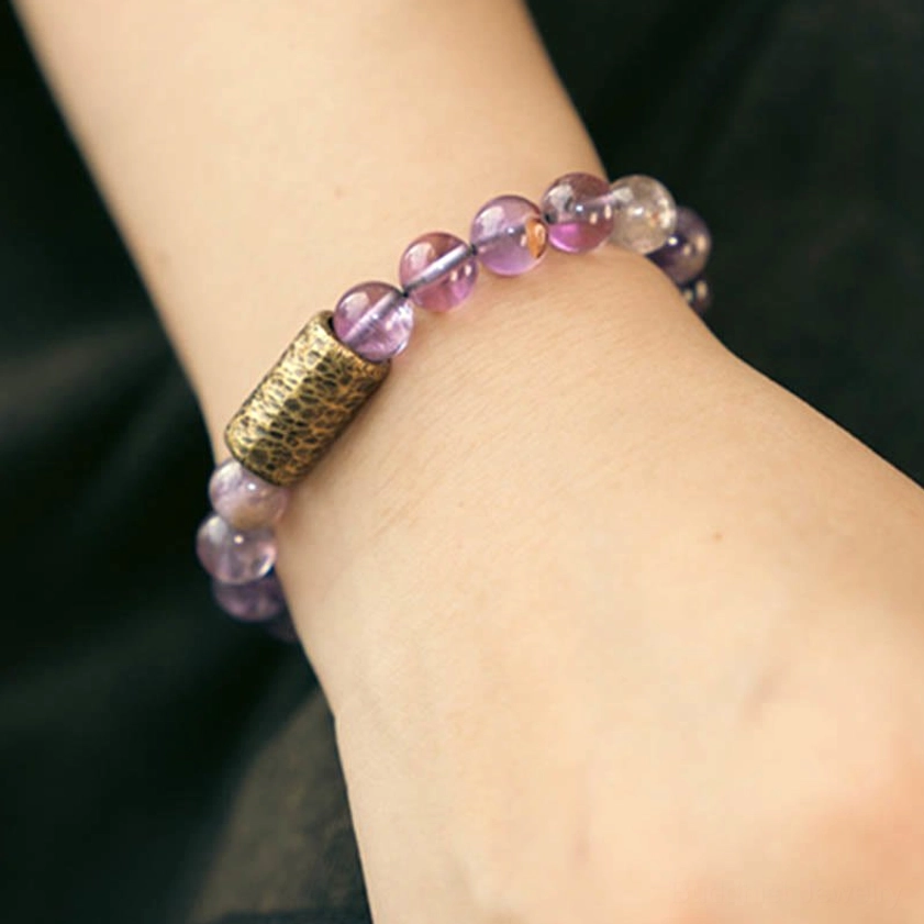 Crystal bracelet with copper accents enhancing energy flow and spiritual significance