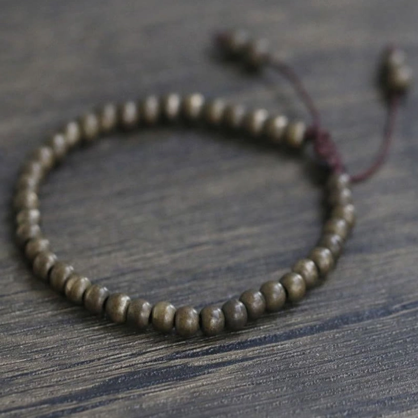 Copper brass beads on adjustable string, Buddhist spiritual bracelet for abundance and inner peace