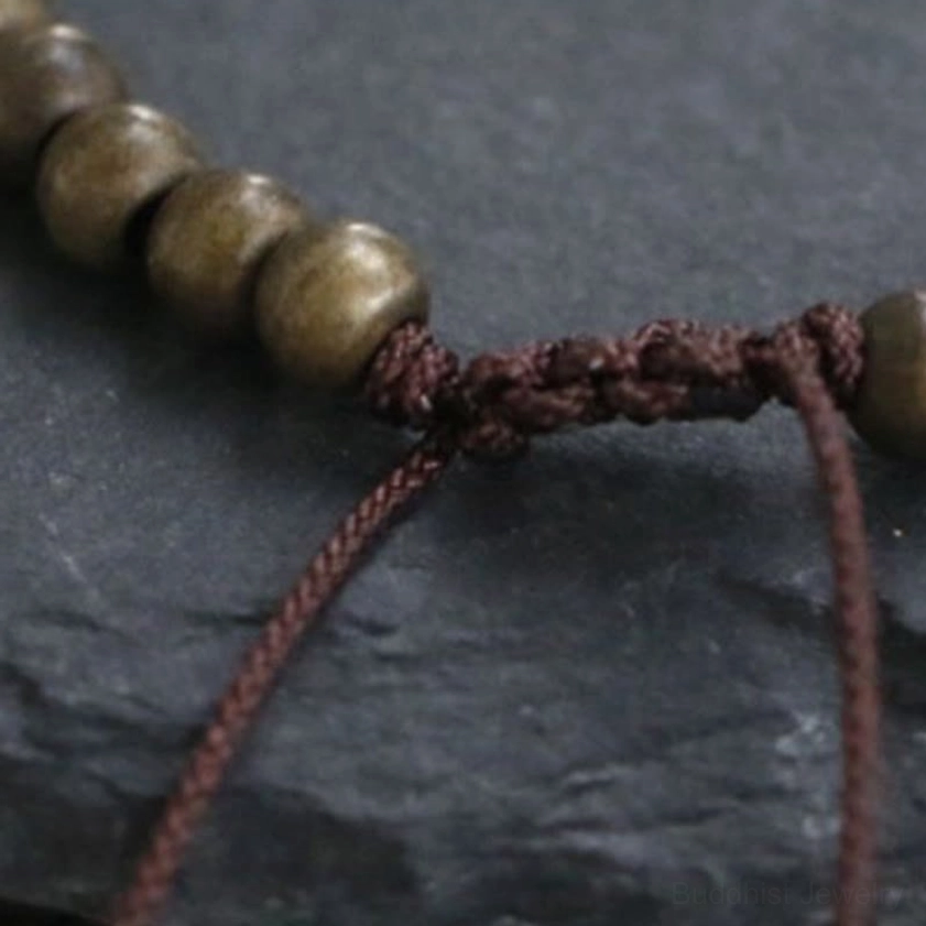 Copper brass beads bracelet for wealth and spiritual balance, full product view with adjustable cord