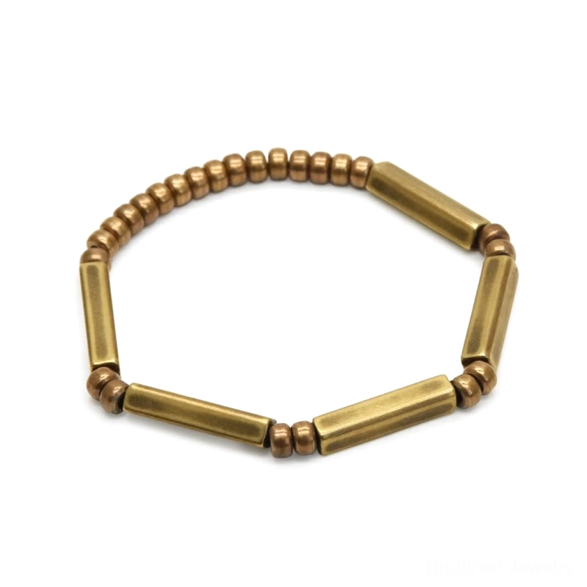 Copper wealth bracelet back-top view, stretchable band with alternating metal bars and round beads on white background